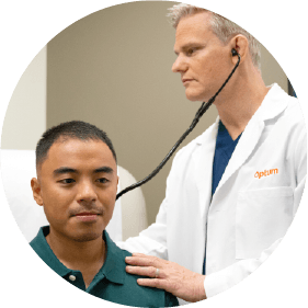 Doctor in Washington using a stethoscope to examine a male patient