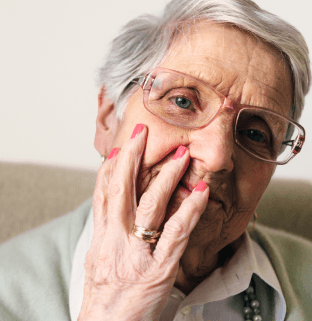 Elderly woman wearing glasses