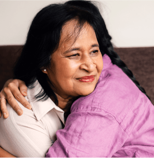 Woman embracing a loved one in a warm hug